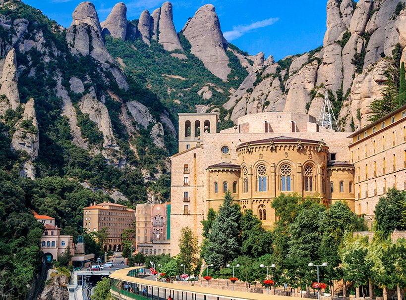 Montserrat Monastery surrounded by rugged mountain peaks near Barcelona | MSC Cruises