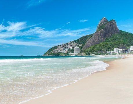A pristine beach with turquoise waters and Sugarloaf Mountain in the background | MSC Cruises A pristine beach with turquoise waters and Sugarloaf Mountain in the background | MSC Cruises
