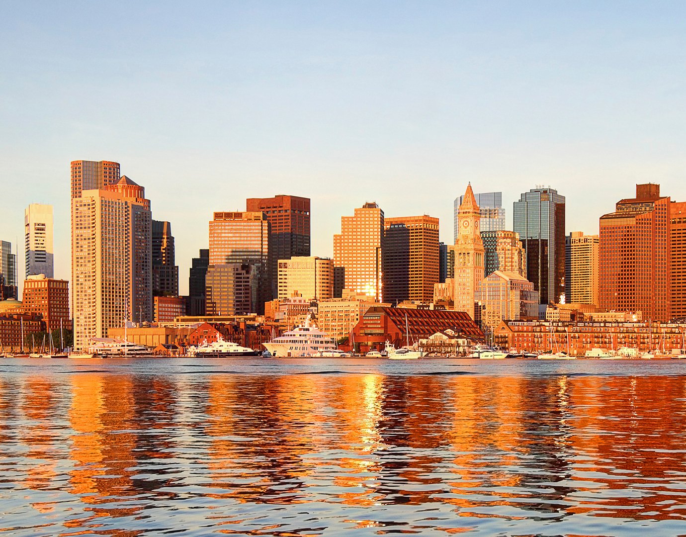 Boston skyline at sunset with waterfront reflections | MSC Cruises Boston skyline at sunset with waterfront reflections | MSC Cruises