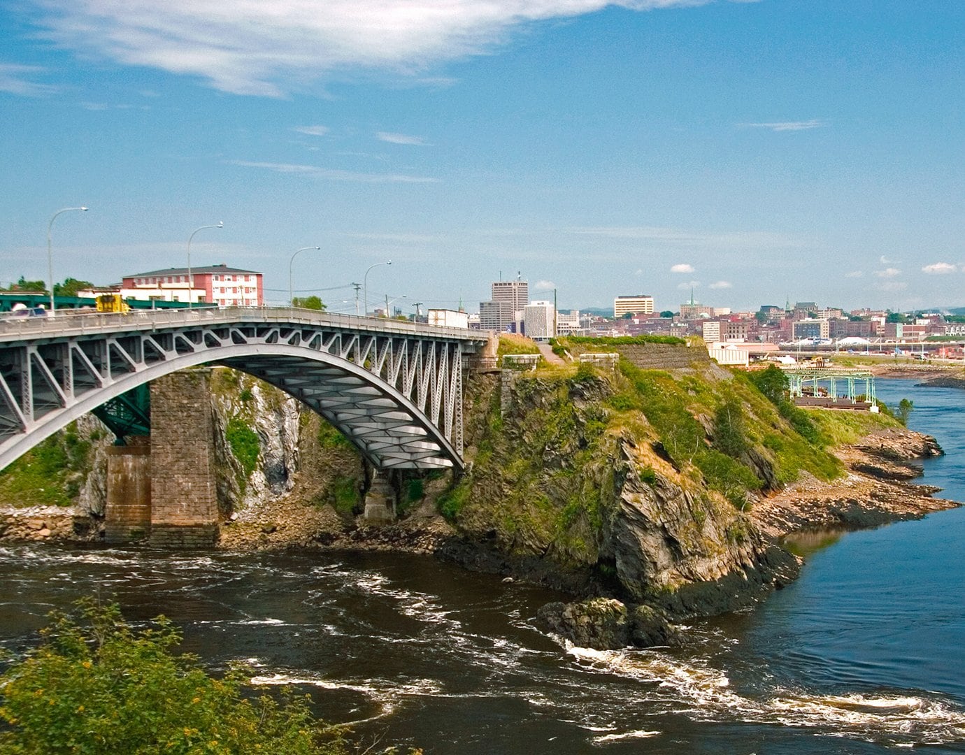 A scenic bridge overlooking cliffs and water in a coastal city | MSC Cruises A scenic bridge overlooking cliffs and water in a coastal city | MSC Cruises