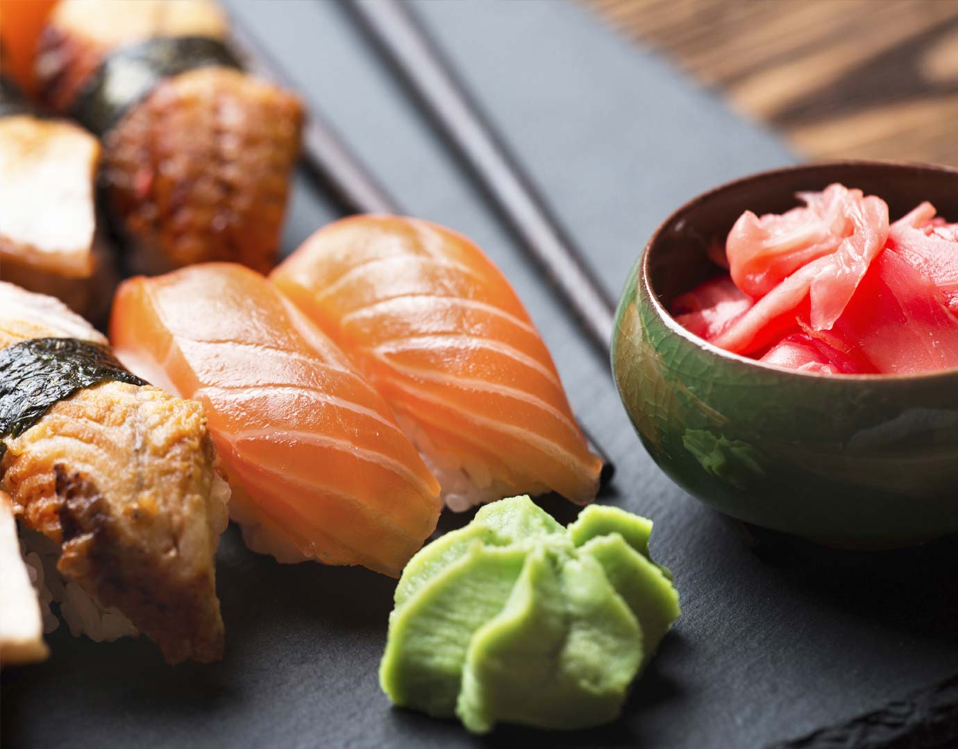 Fresh sushi with salmon, wasabi, and pickled ginger on a slate plate | MSC Cruises