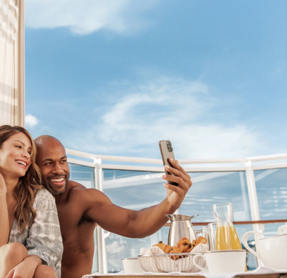 A couple enjoying breakfast on a sunny cruise ship deck | MSC Cruises