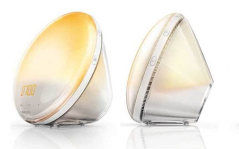 Two modern sunrise simulation alarm clocks with warm yellow light | MSC Cruises Two modern sunrise simulation alarm clocks with warm yellow light | MSC Cruises