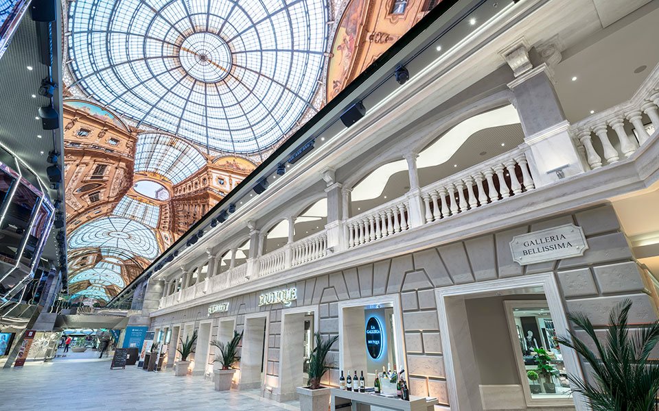 Luxurious shopping promenade with elegant architecture and LED dome ceiling onboard a cruise ship | MSC Cruises Luxurious shopping promenade with elegant architecture and LED dome ceiling onboard a cruise ship | MSC Cruises