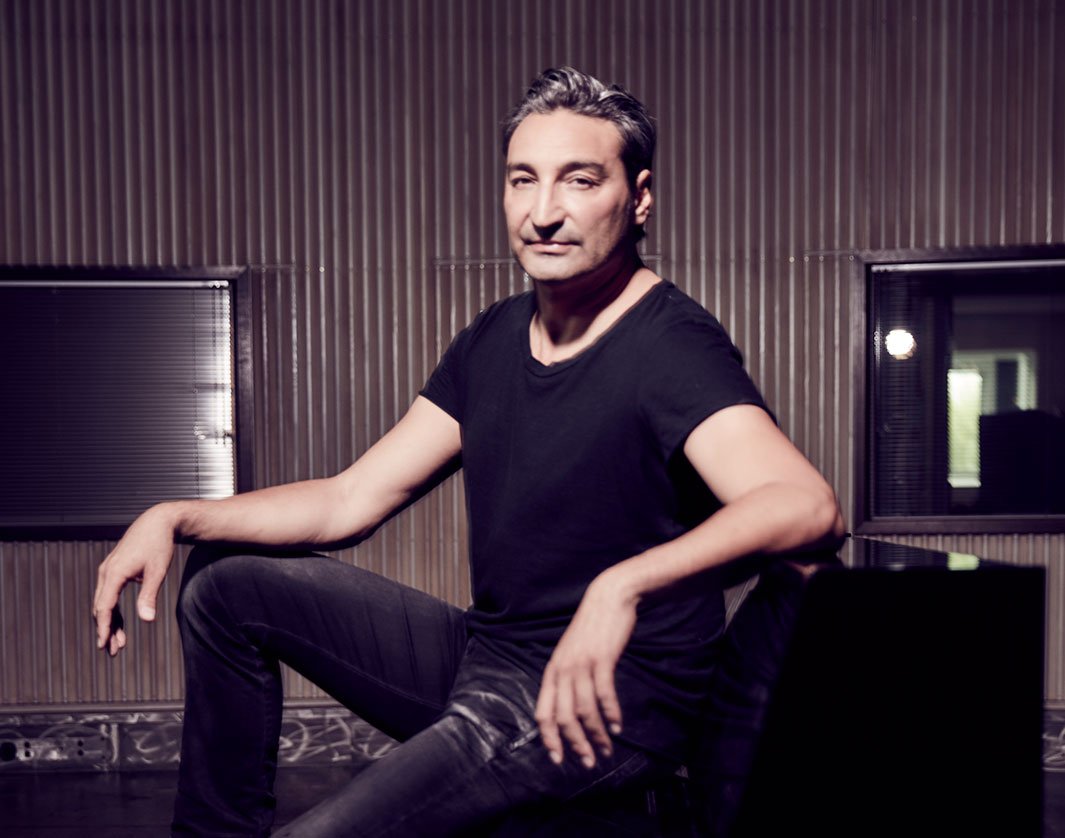 A person sitting in a modern lounge area with metallic walls | MSC Cruises A person sitting in a modern lounge area with metallic walls | MSC Cruises