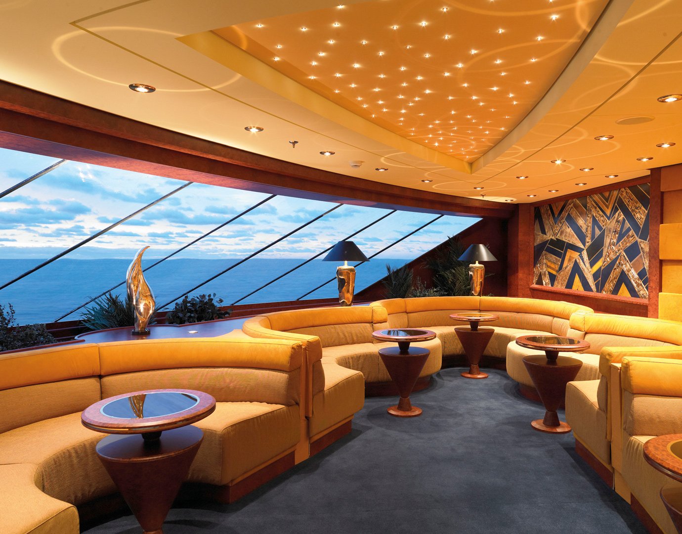 Luxurious lounge with ocean views and starry ceiling lighting on an MSC ship | MSC Cruises Luxurious lounge with ocean views and starry ceiling lighting on an MSC ship | MSC Cruises