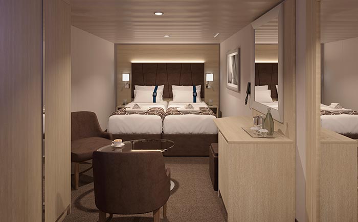 Elegant cruise ship cabin with double bed, seating area, and modern decor | MSC Cruises Elegant cruise ship cabin with double bed, seating area, and modern decor | MSC Cruises